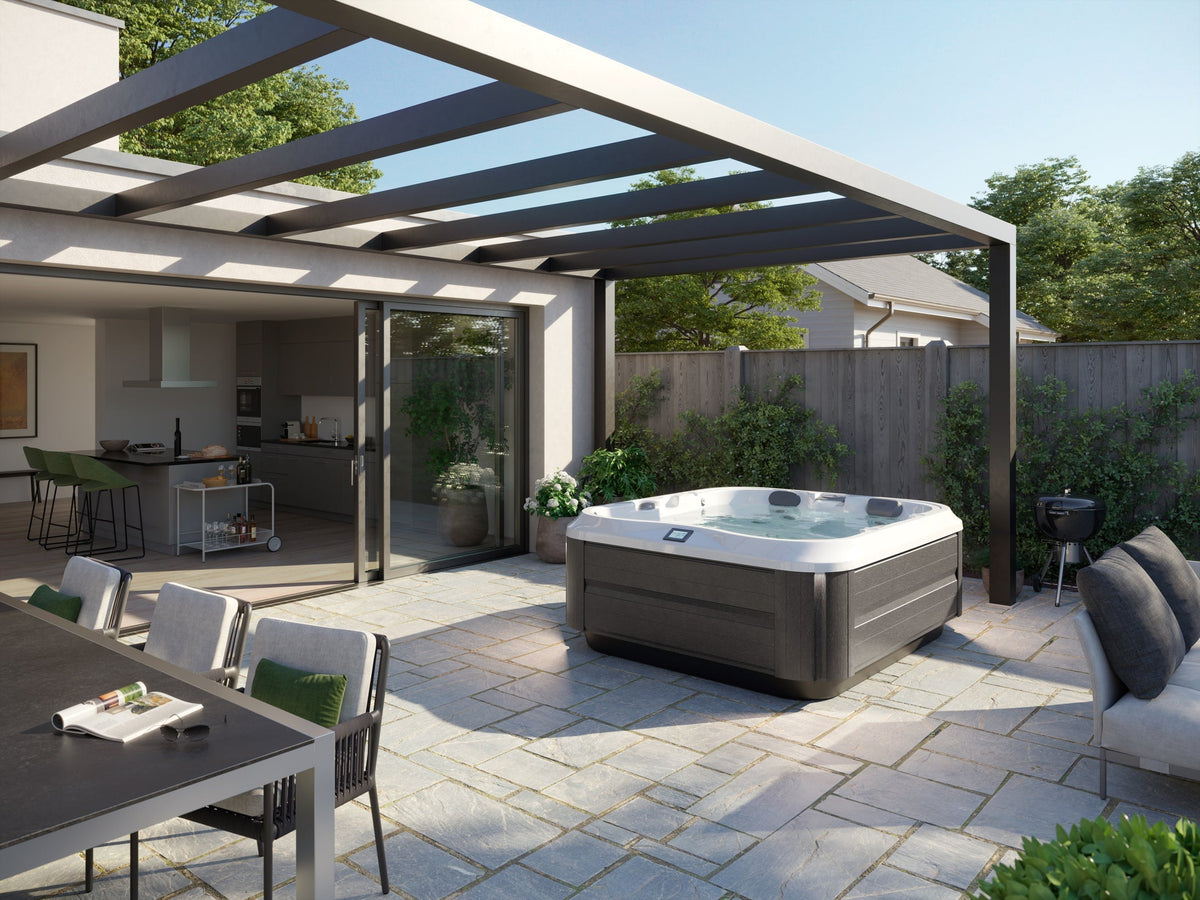 Jacuzzi J-300 Collection luxury hot tub on an outdoor patio, available at Jacuzzi Hot Tubs Rochester, NY.