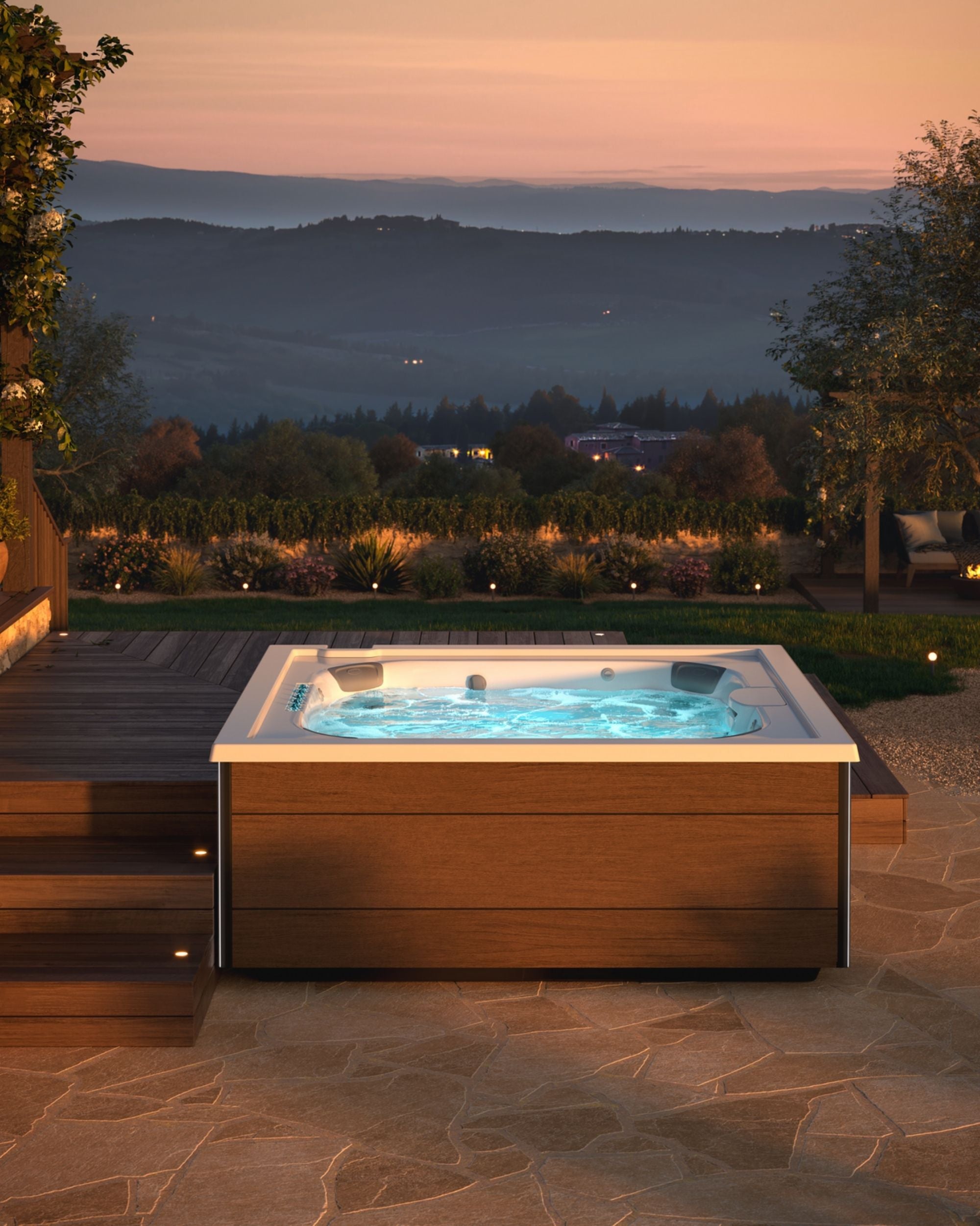 Hot tub with glowing water in a garden setting at dusk